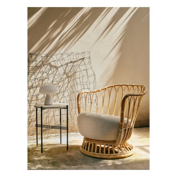 Outdoor Woven Rope Swivel Lounge Chair with Cushions in black — in a room setting