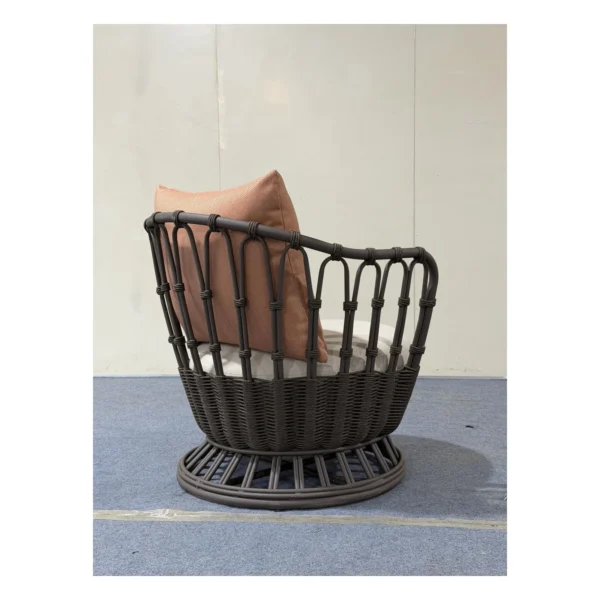 Outdoor Woven Rope Swivel Lounge Chair with Cushions in black — in a room setting