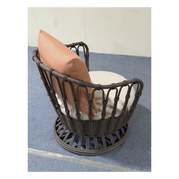 Outdoor Woven Rope Swivel Lounge Chair with Cushions in black — in a room setting