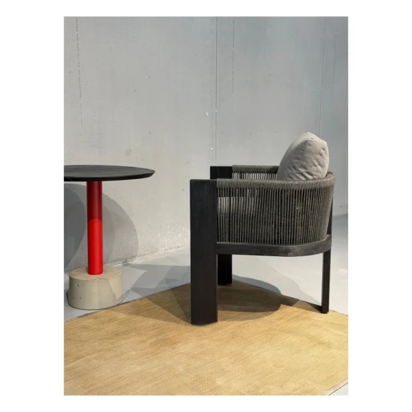 Outdoor Rope-Woven Armchair Set with Teak Pedestal Table in black — in a room setting