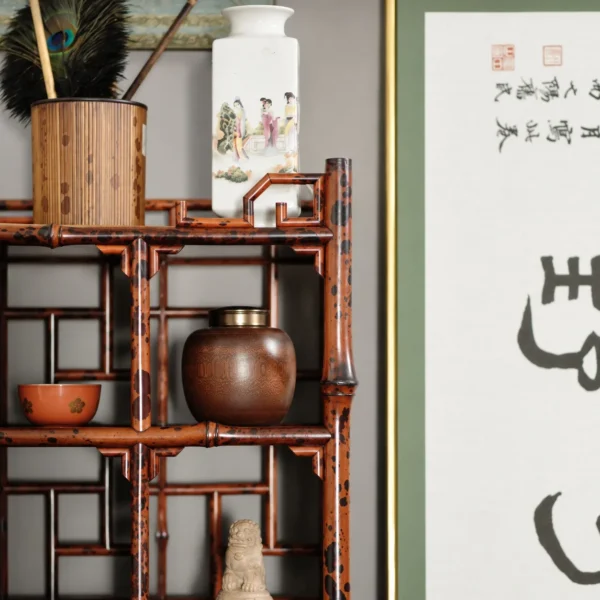 Bamboo Curio Bookcase in clay — in a room setting
