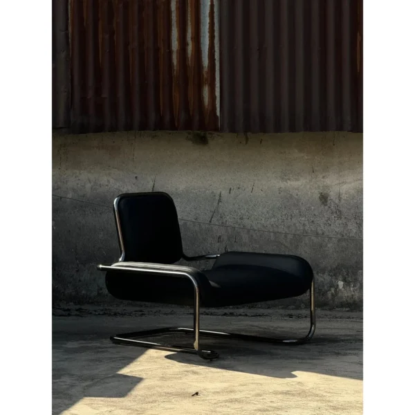 Bauhaus Black Leather Cantilever Lounge Chair on Steel Frame in black — in a room setting