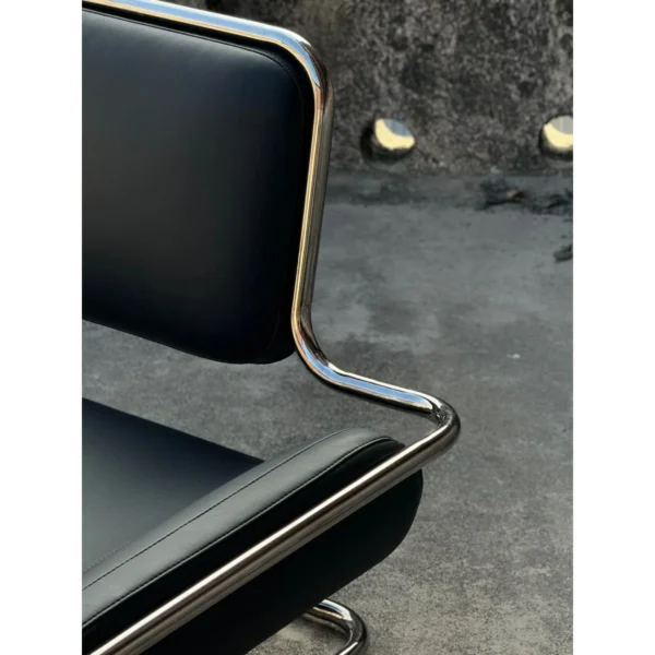 Bauhaus Black Leather Cantilever Lounge Chair on Steel Frame in black — in a room setting