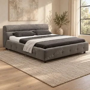 Grey Bed with Tufted Base and Pillow Headboard in slate — in a room setting