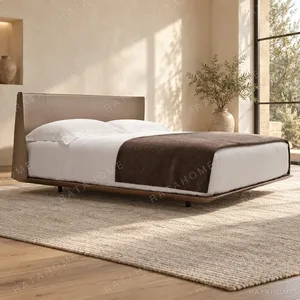 Greige Leather Bed with Rounded Panel Headboard on Walnut in sand — in a room setting