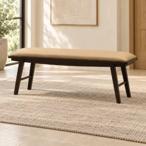Tan Leather Bench on Dark Splayed Legs in clay — in a room setting