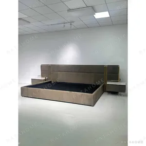 Khaki Suede Bed with Brass Trim and Floating Nightstands in clay — in a room setting