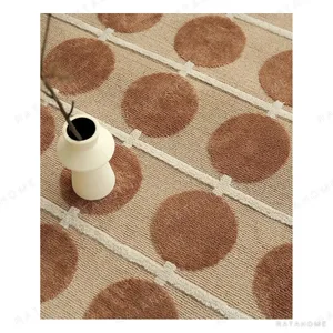 Beige Rug with Red-Brown Dot Grid in sand — in a room setting