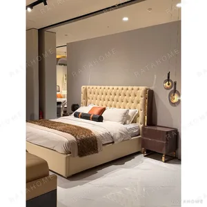 Bella Diamond-Tufted Leather Bed with Steel Trim in oatmeal — in a room setting