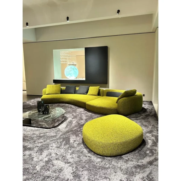 Bessel Curved Sectional Sofa in olive — in a room setting