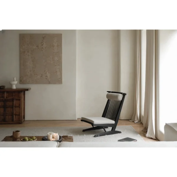 Black Spindle-Back Cantilever Lounge Chair with Wood Seat in black — in a room setting