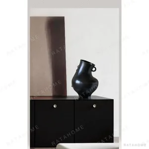 Black Glaze Twin-Ear Ewer Vase with Angled Neck in black — in a room setting