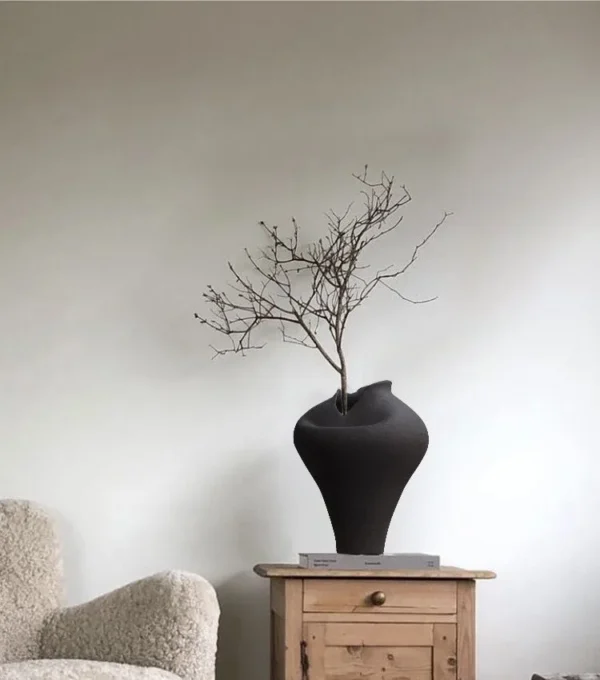 Jingdezhen Black Pinched-Rim Ceramic Jar Vase, Medium in black — in a room setting