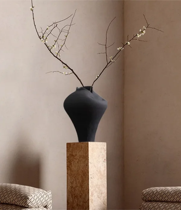 Jingdezhen Black Pinched-Rim Ceramic Jar Vase, Medium in black — in a room setting