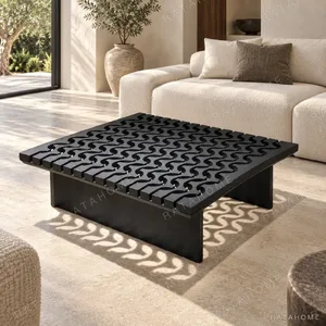 Black Solid Wood Coffee Table with Pierced Wave Top in black — in a room setting