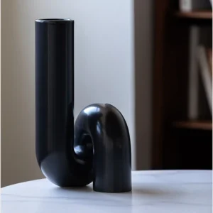 Black Twisted Tube Sculptural Ceramic Vase in black — front view