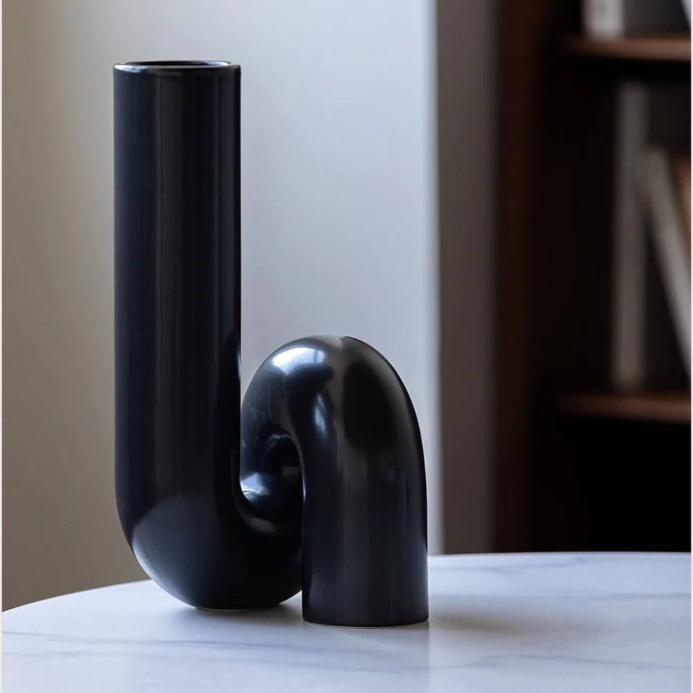 Black Twisted Tube Sculptural Ceramic Vase in black — front view