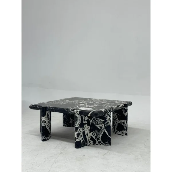 Black and White Breccia Marble Coffee Table in black — in a room setting