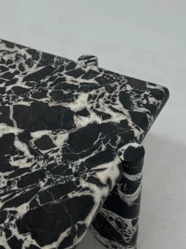 Black and White Breccia Marble Coffee Table in black — in a room setting