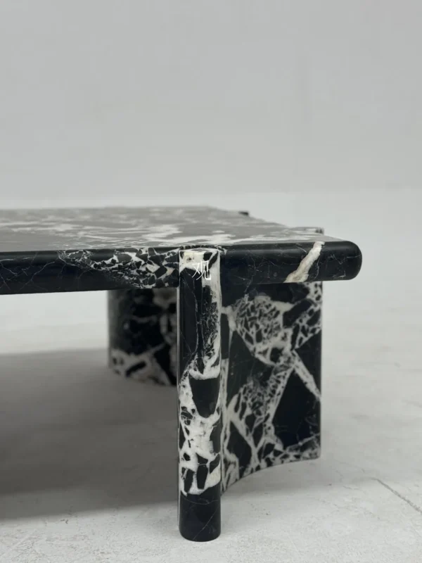 Black and White Breccia Marble Coffee Table in black — in a room setting