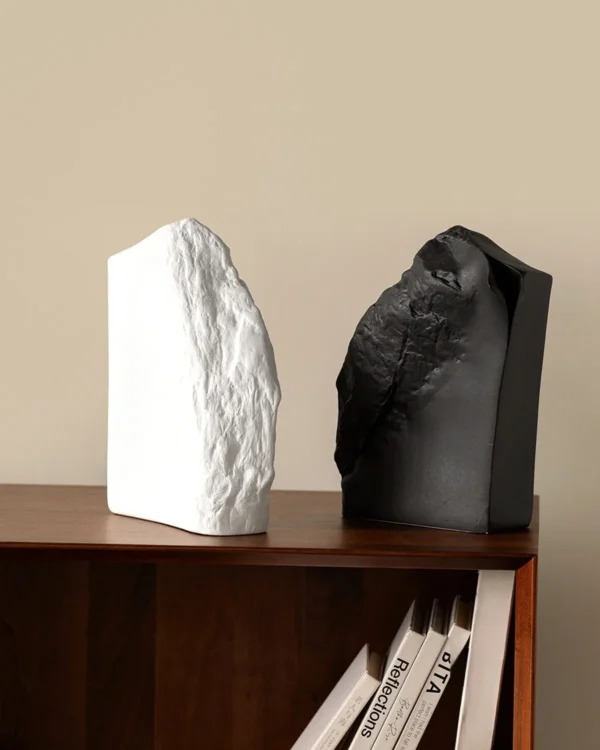 Black Rock Texture Ceramic Sculpture Vase in black — in a room setting