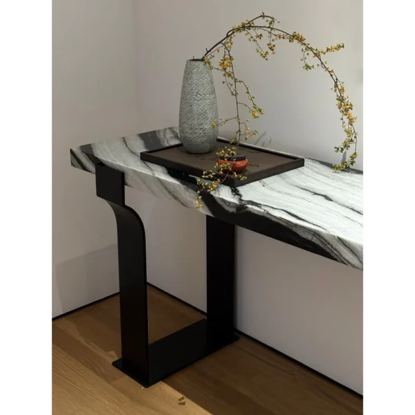 Arche Black-and-White Marble Console on Curved Metal Base in ivory — in a room setting