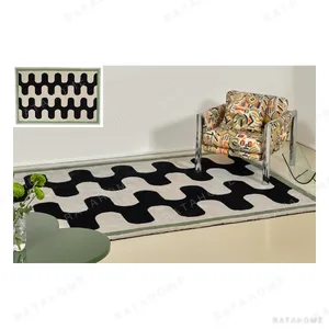 Black and White Wave Check Rug with Green Border in black — in a room setting