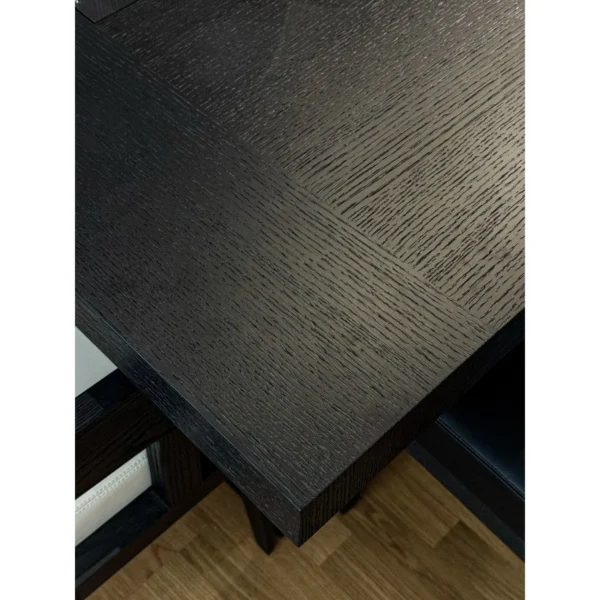 Black Oak Long Dining Table with Black and White Chairs in black — in a room setting