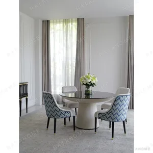 Beech Marquetry Round Table with Blue Jacquard Dining Chairs in natural oak — in a room setting