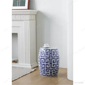 Blue and White Fretwork Hand-Painted Ceramic Drum Stool in blue — in a room setting