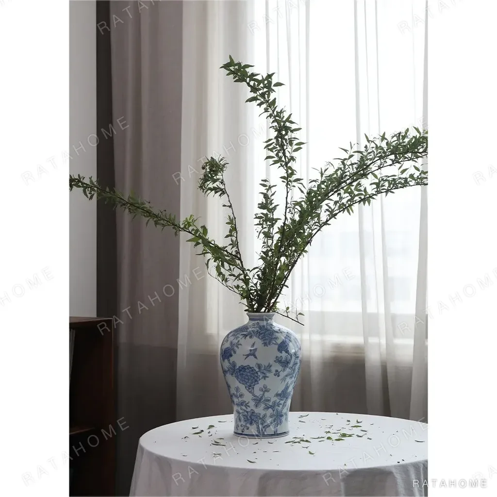 Hand-Painted Blue and White Flower and Bird Plum Vase in blue — in a room setting