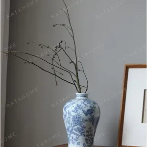 Hand-Painted Blue and White Flower and Bird Plum Vase in blue — in a room setting