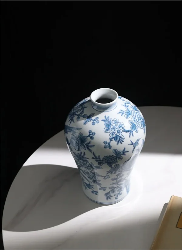 Hand-Painted Blue and White Flower and Bird Plum Vase in blue — in a room setting