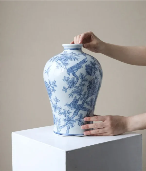 Hand-Painted Blue and White Flower and Bird Plum Vase in blue — in a room setting