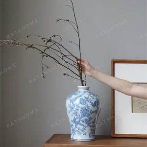 Hand-Painted Blue and White Flower and Bird Plum Vase in blue — in a room setting