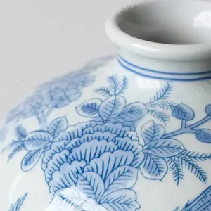Hand-Painted Blue and White Flower and Bird Plum Vase in blue — in a room setting