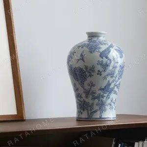 Hand-Painted Blue and White Flower and Bird Plum Vase in blue — in a room setting