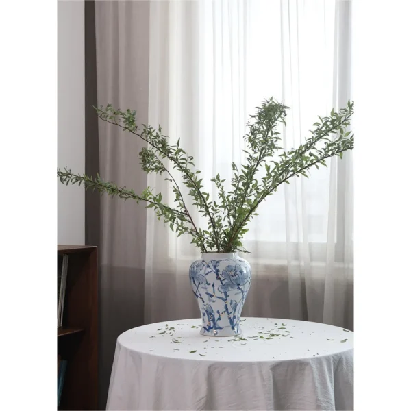 Hand-Painted Blue and White Orchid General Jar in blue — in a room setting