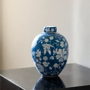 Blue Ground White Floral Lidded Jar Vase in blue — front view