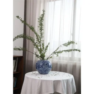Hand-Painted Blue Ground Floral Lidded Jar, Large in blue — in a room setting