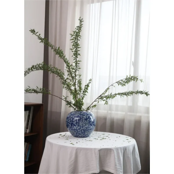 Hand-Painted Blue Ground Floral Lidded Jar, Large in blue — in a room setting