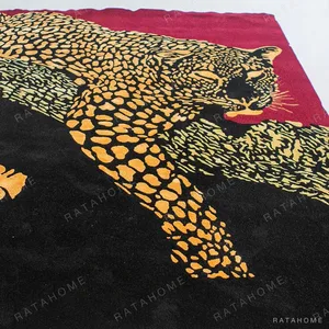Leopard on Burgundy Statement Rug in burgundy — in a room setting