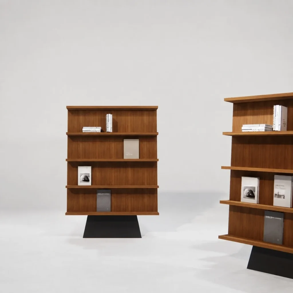 Walnut Freestanding Bookcase on Sculpted Black Pedestal in walnut — front view