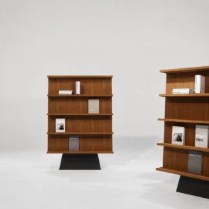 Walnut Freestanding Bookcase on Sculpted Black Pedestal in walnut — front view