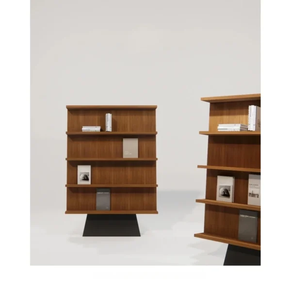 Walnut Freestanding Bookcase on Sculpted Black Pedestal in walnut — in a room setting