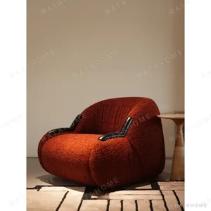 Breathing Brick Red Teddy Shearling Lounge Chair in red — in a room setting