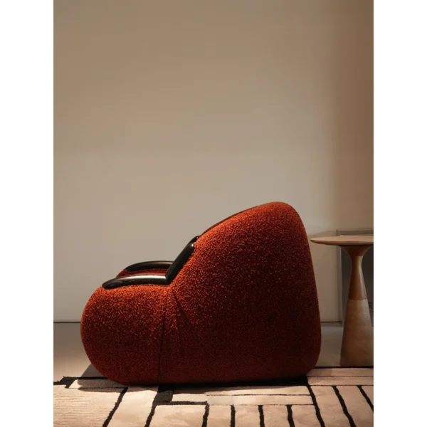 Breathing Brick Red Teddy Shearling Lounge Chair in red — in a room setting