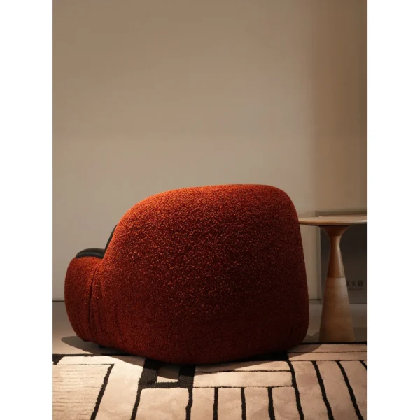 Breathing Brick Red Teddy Shearling Lounge Chair in red — in a room setting