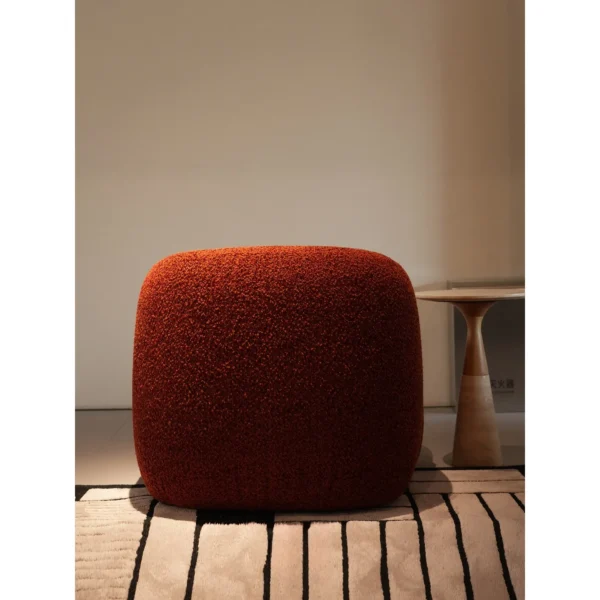 Breathing Brick Red Teddy Shearling Lounge Chair in red — in a room setting