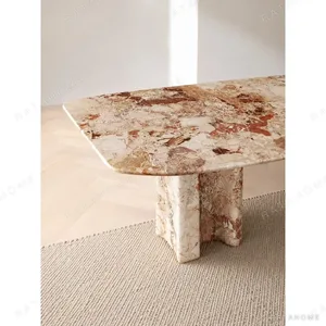 Breccia Marble Long Dining Table on Stone Slabs in rust — in a room setting